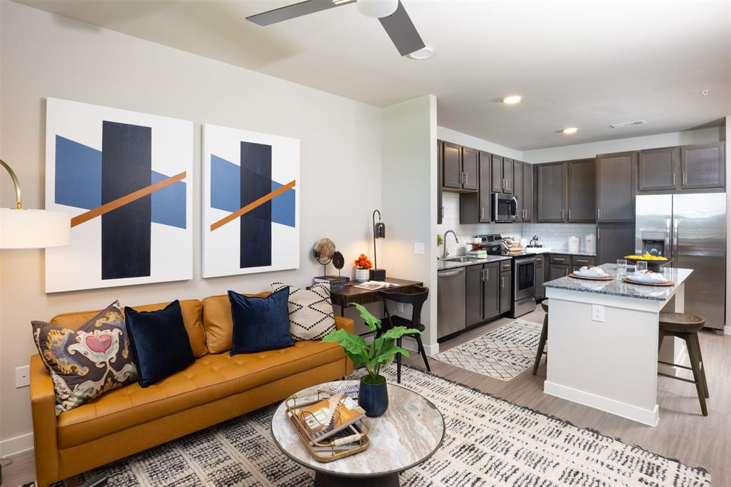 a living room with furniture kitchen and kitchen view