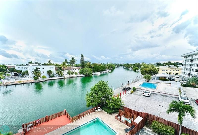 an aerial view of a house with a lake view