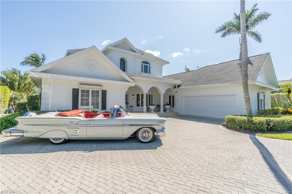 a front view of a house with parking