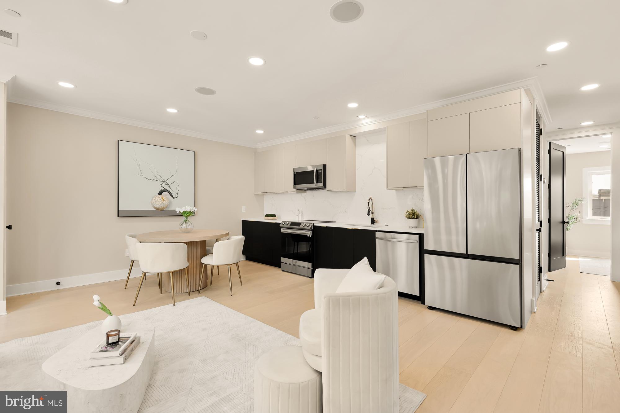 a kitchen with a refrigerator and a sink