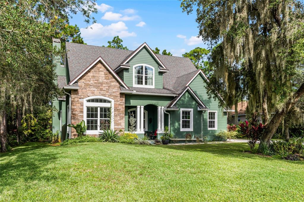 front view of a house with a yard