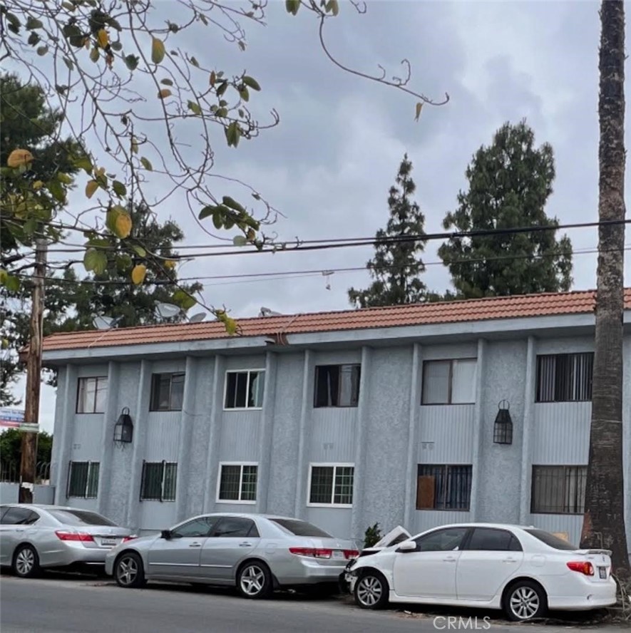 a front view of a building with parking space