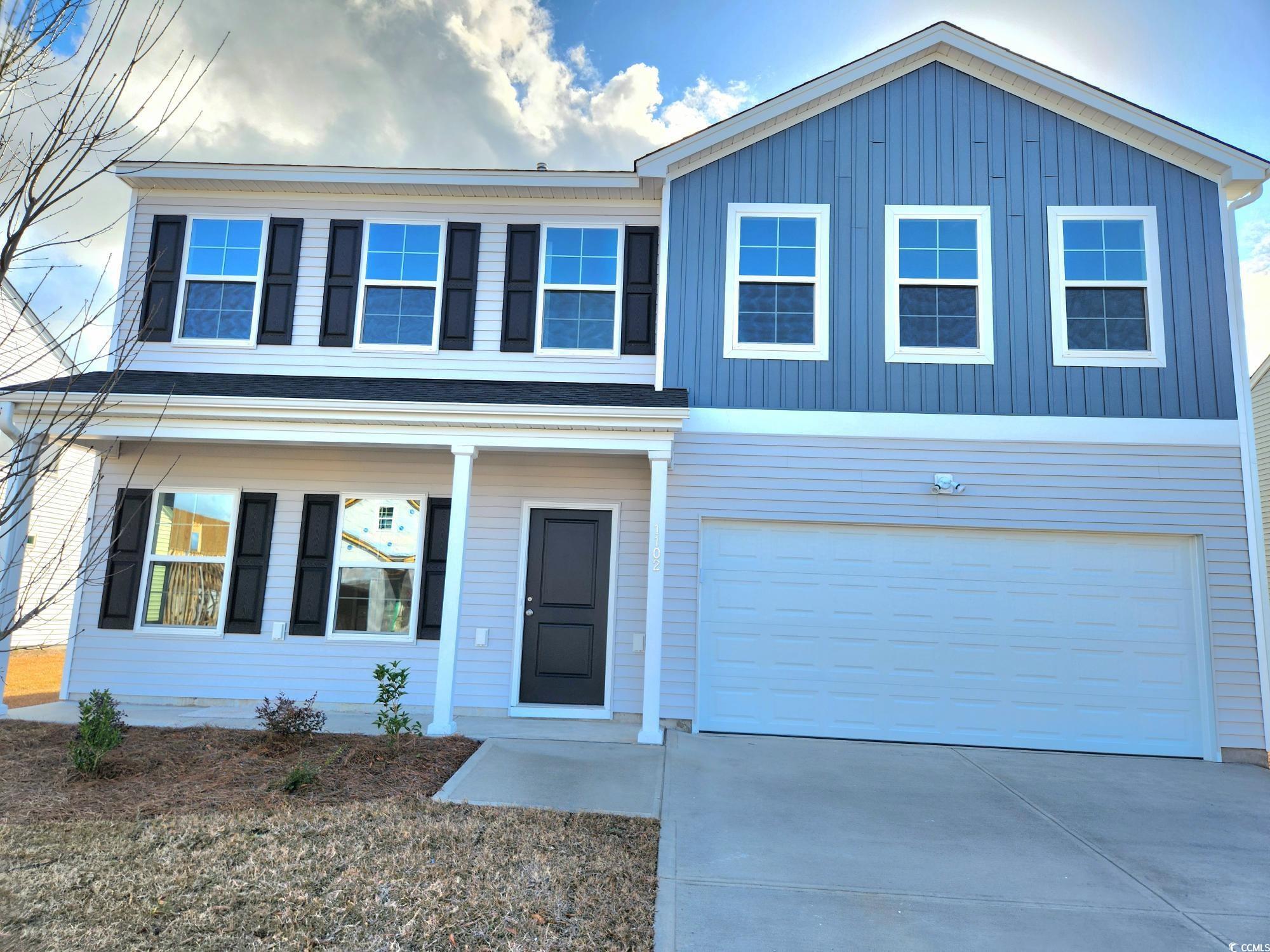 View of front of house featuring a garage