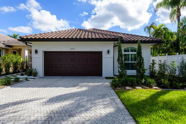 $1,050,000 | 2191 Regents Boulevard | The Villages of Palm Beach Lakes