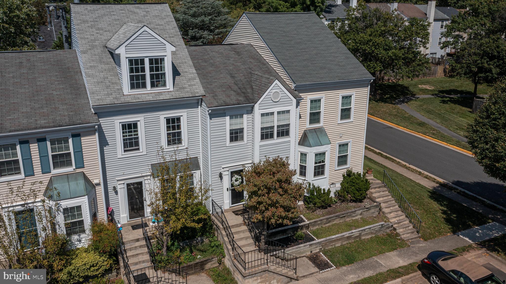 a aerial view of a house with yard