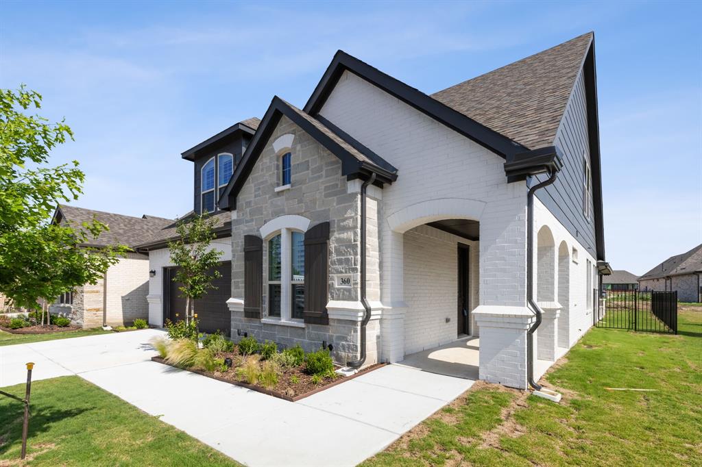 a front view of house with yard outdoor seating and barbeque oven