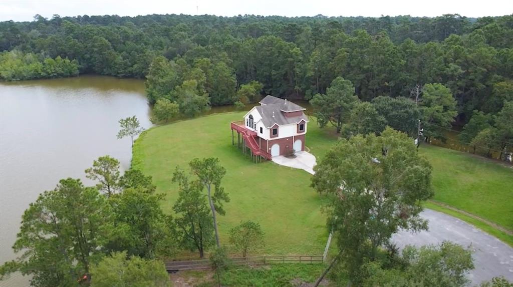 a aerial view of a house with a yard