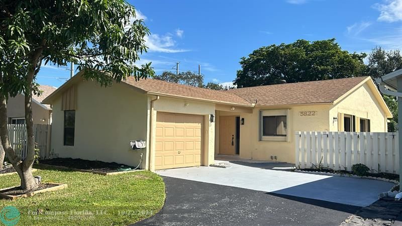 a house with trees in the background