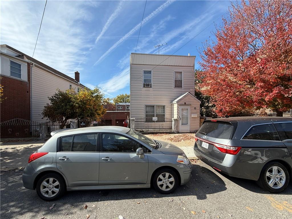 a view of a car parked in front of a house