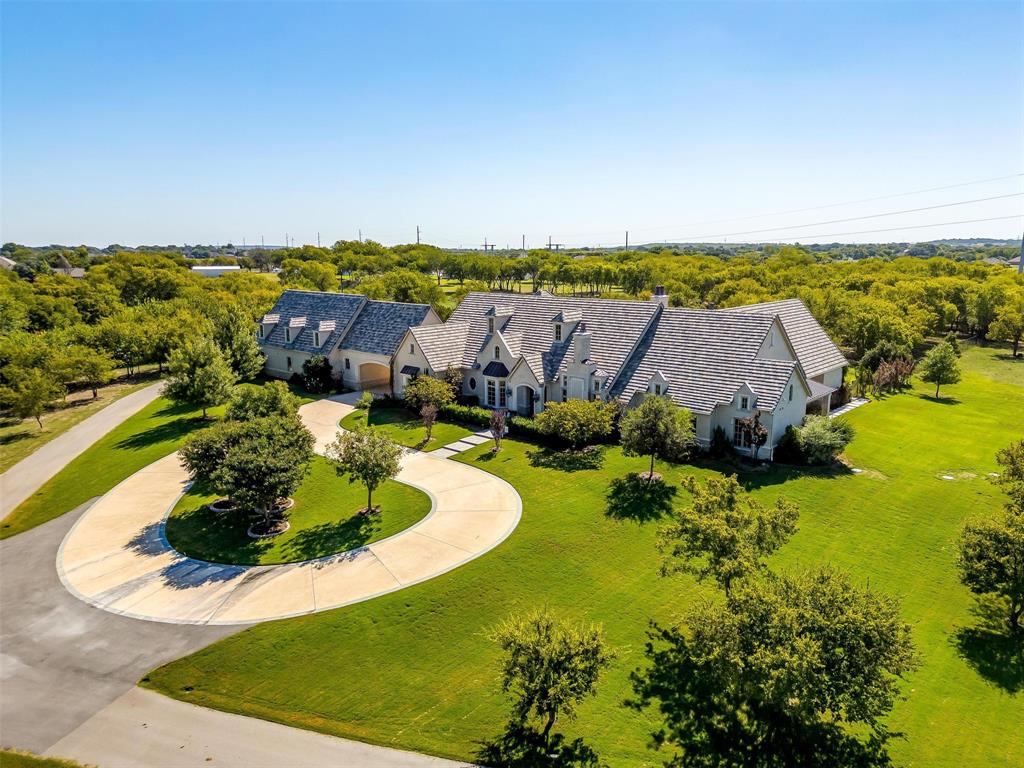 an aerial view of a house with a garden