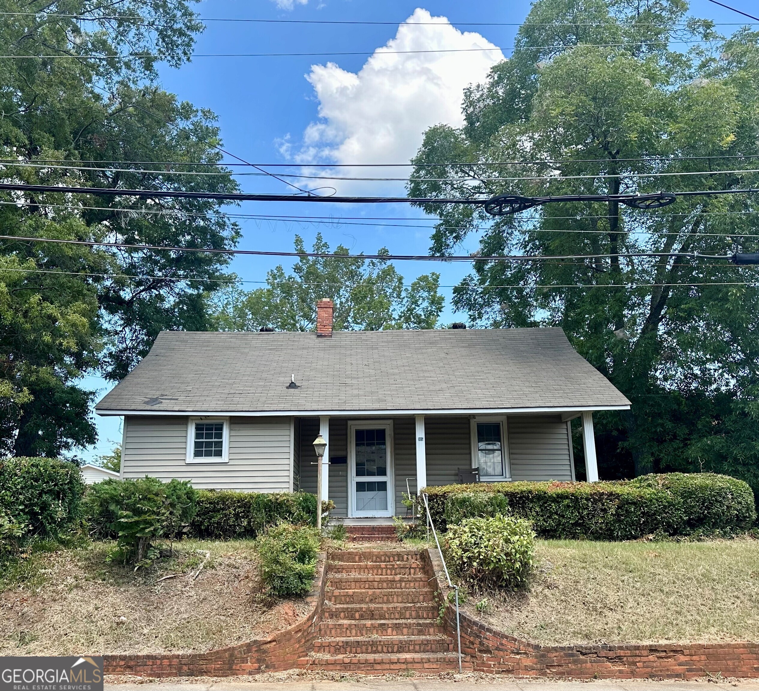 front view of a house with a dry yard