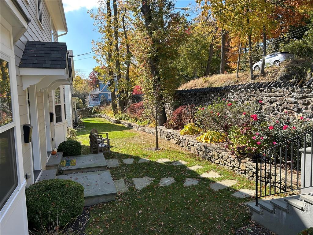 View of entry steps and landscape