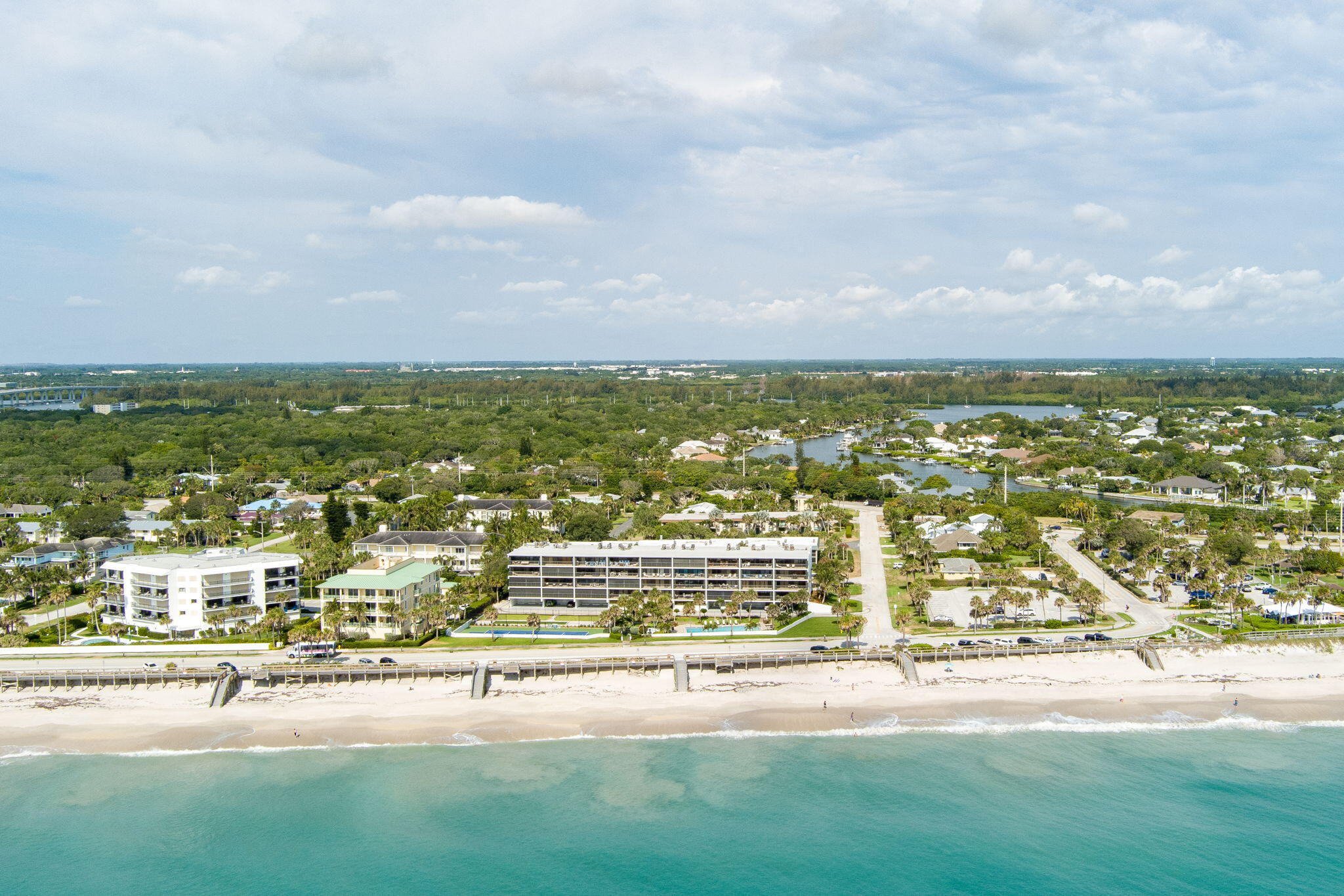 an aerial view of residential building and ocean