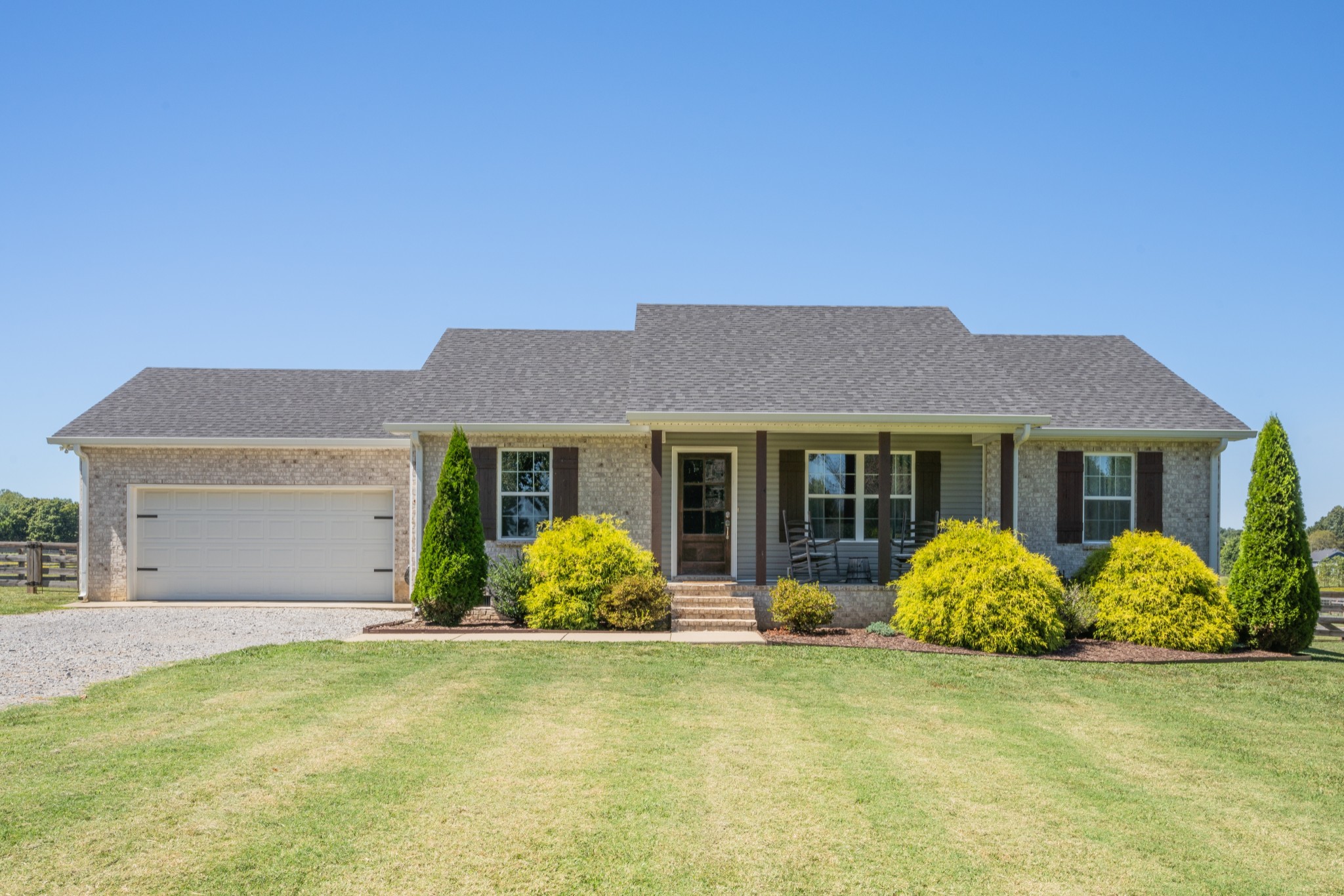 a front view of a house with garden