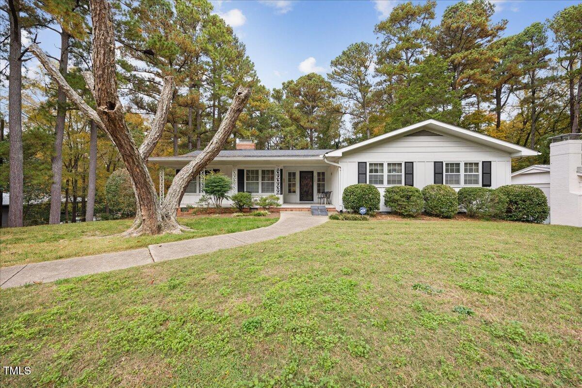 a house with trees in the background