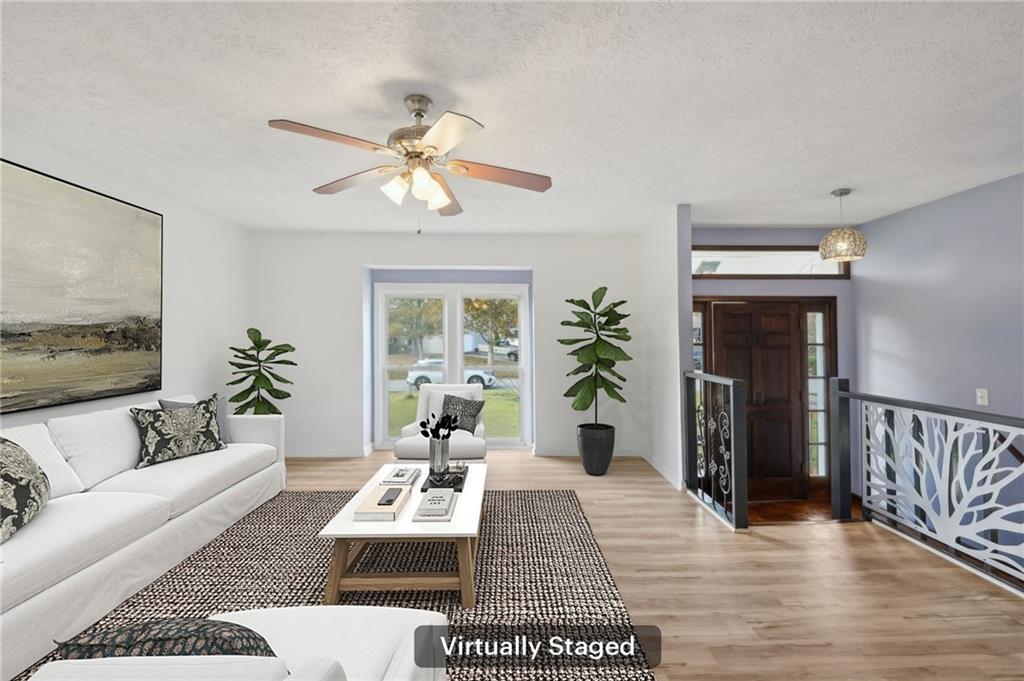 a living room with furniture and a window