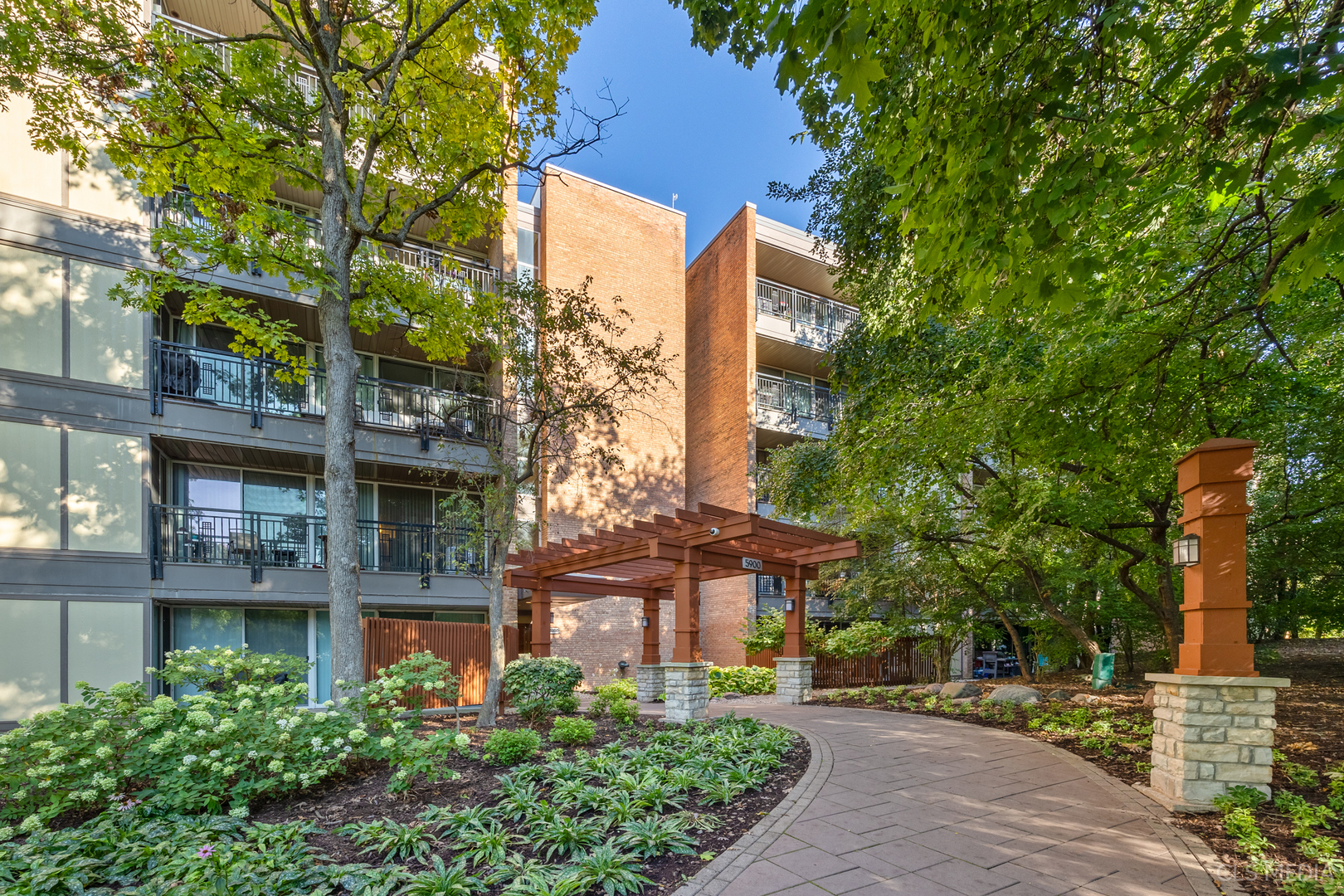 a view of a building with a yard