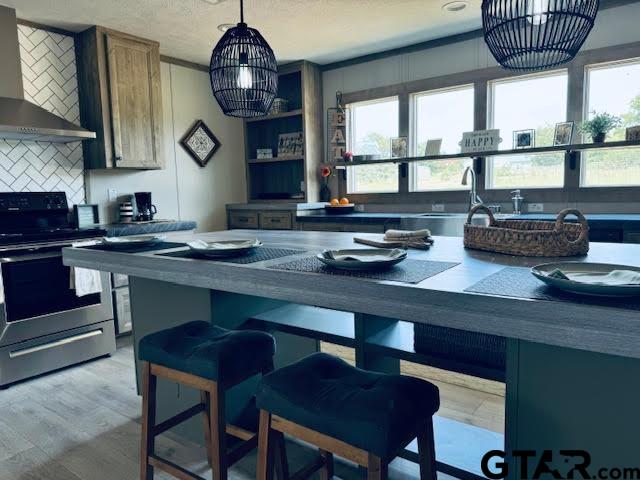 a kitchen with a table and chairs in it