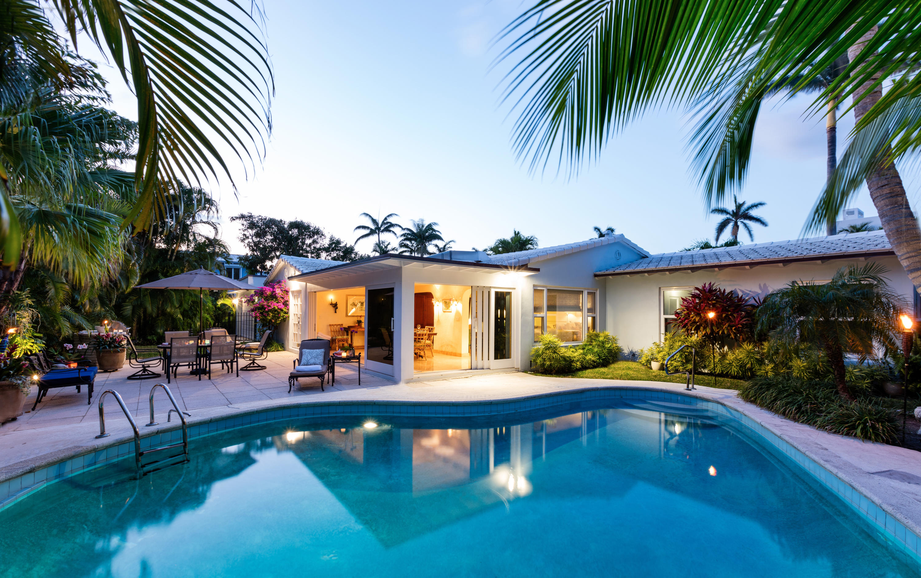 a front view of house with yard and outdoor seating