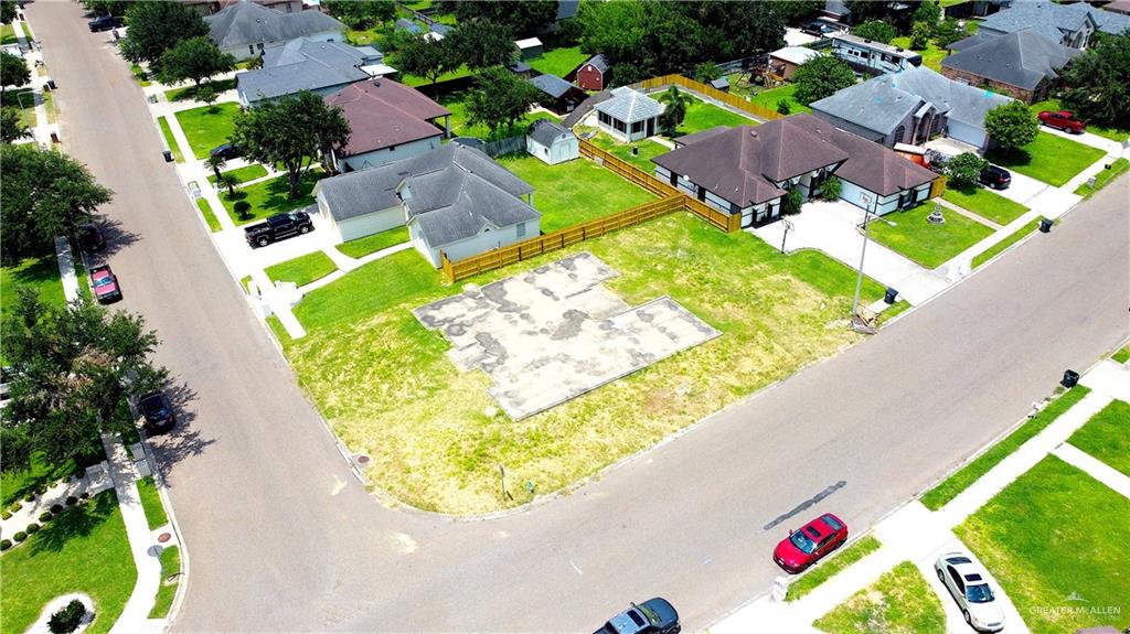 an aerial view of a house with a swimming pool