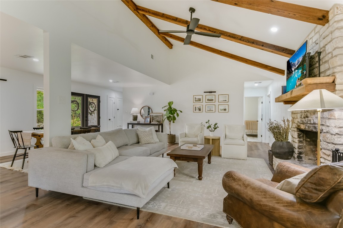 a living room with furniture and a fireplace