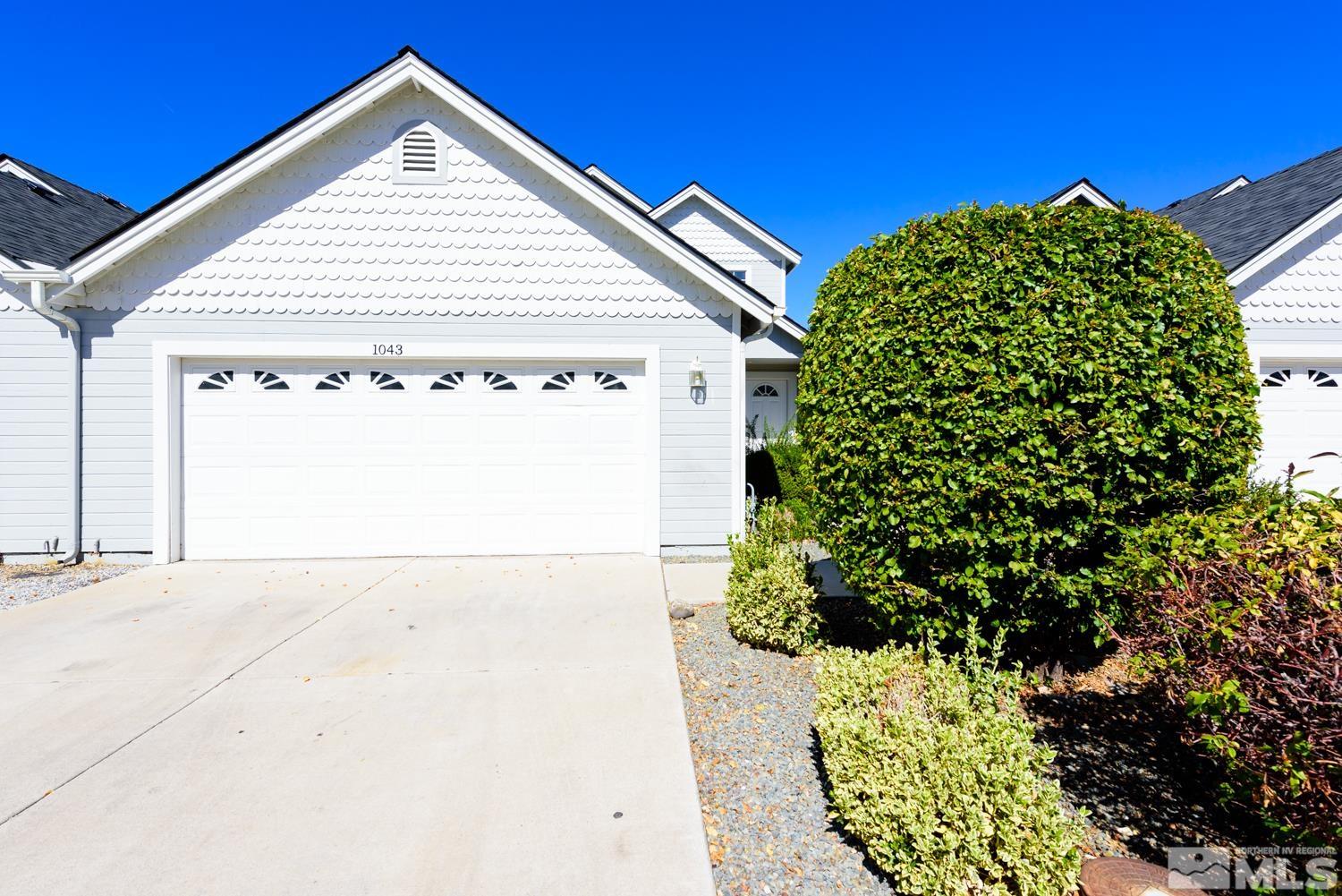 a view of a house with a small yard