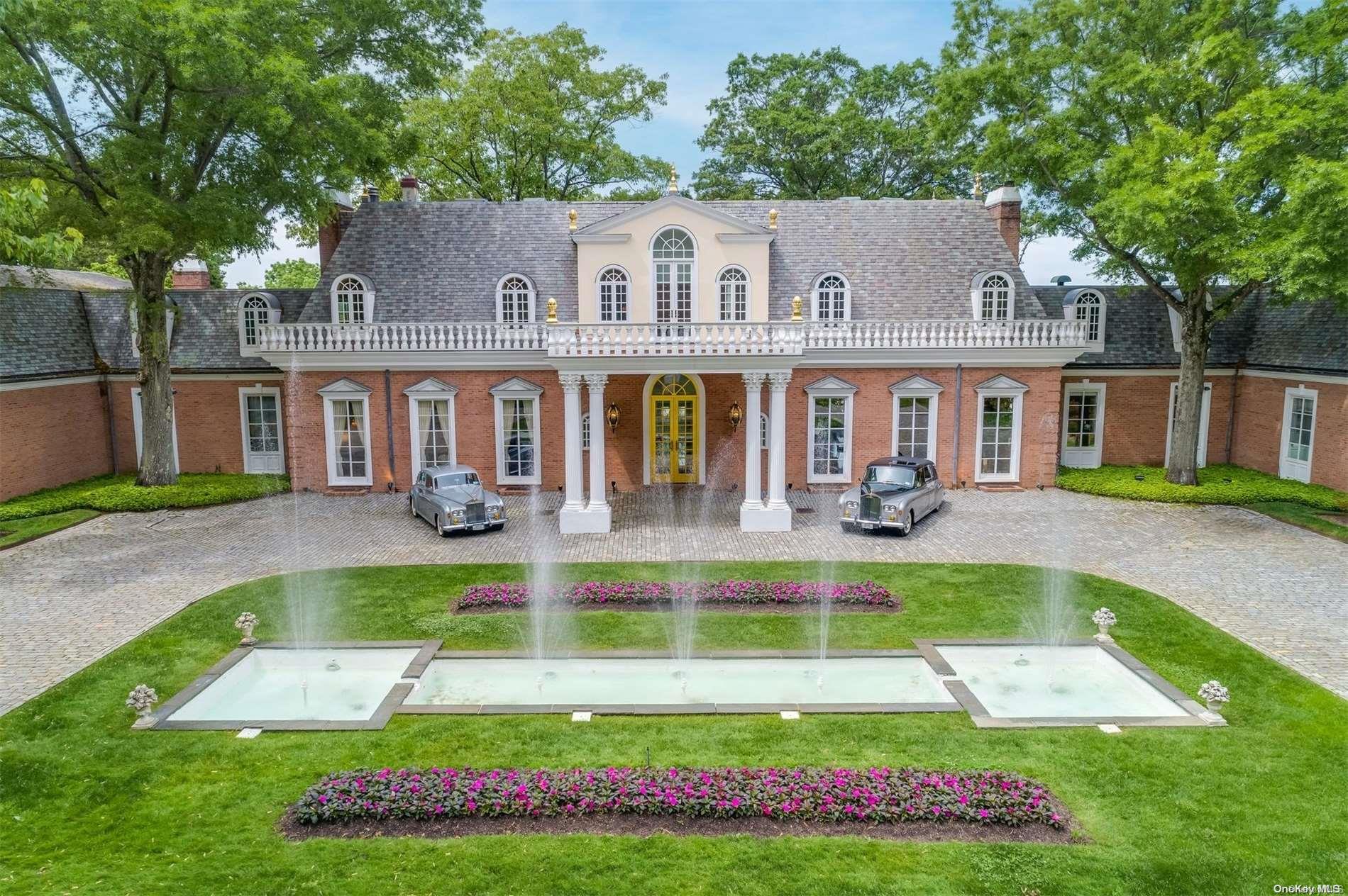 a view of a house with swimming pool and a yard