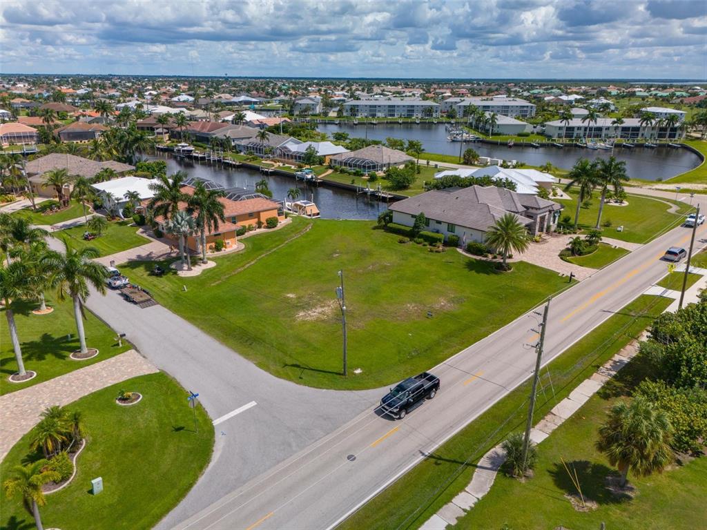 an aerial view of residential houses with outdoor space