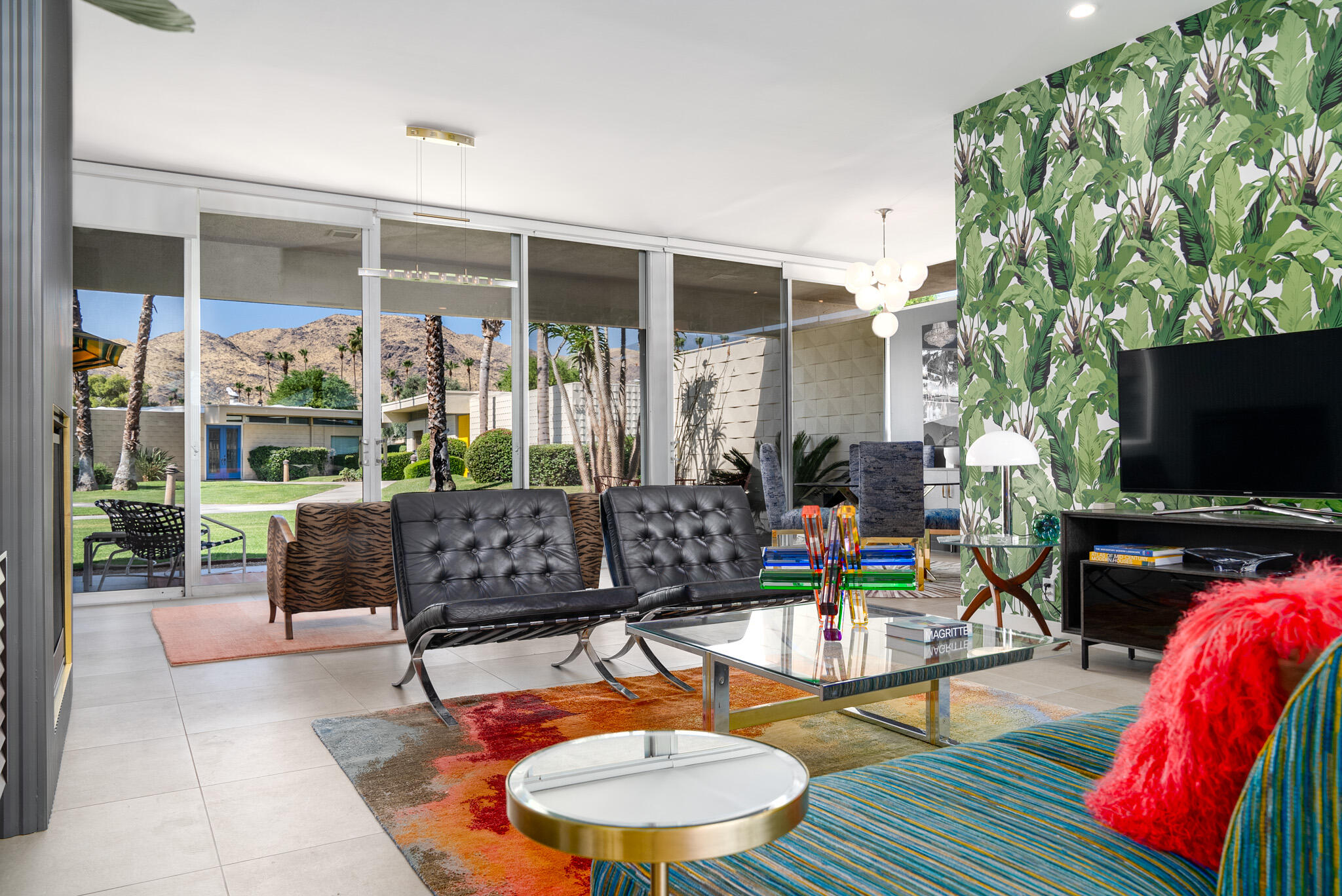 a outdoor living space with furniture and a flat screen tv