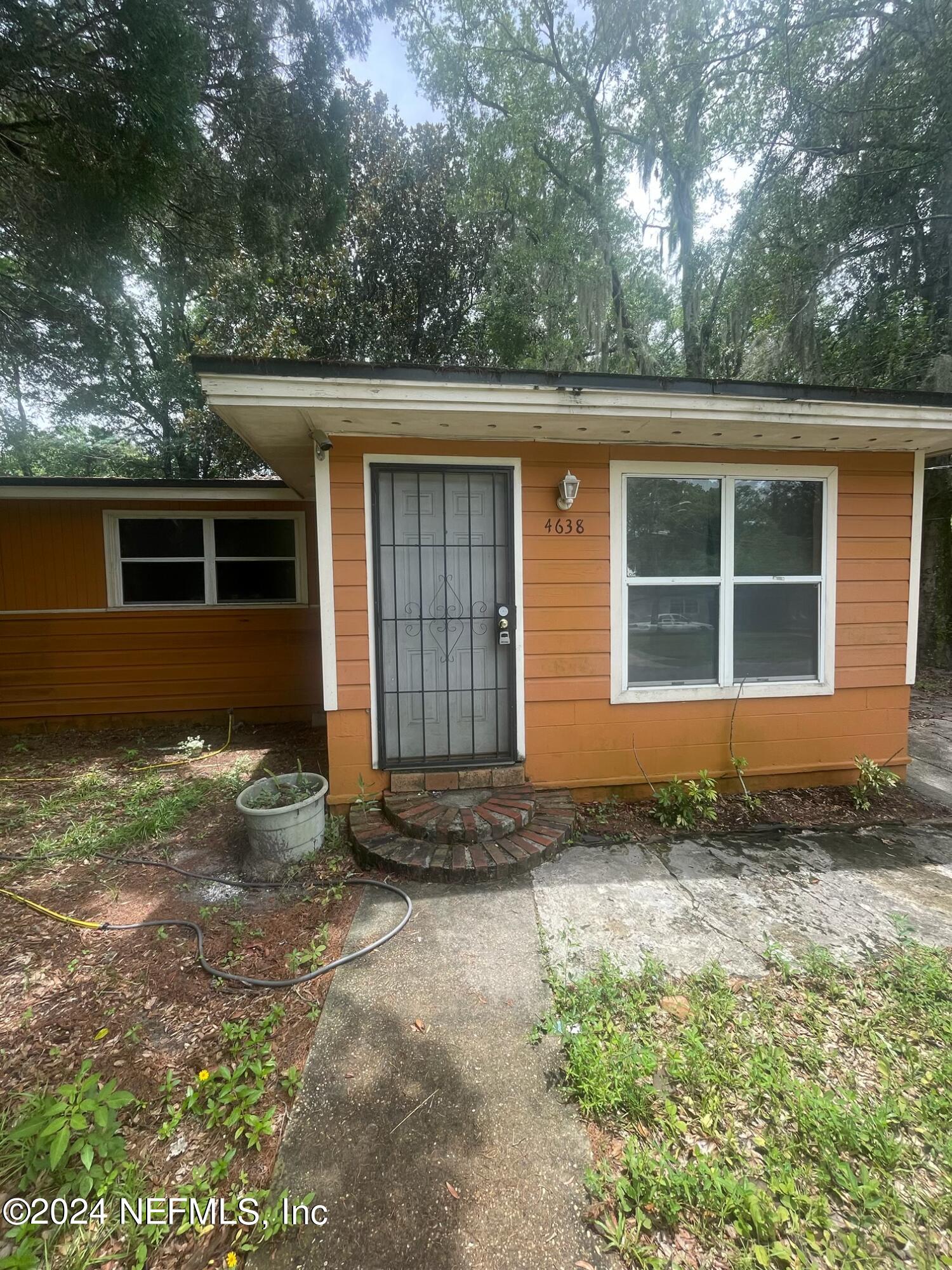 a house with trees in the background