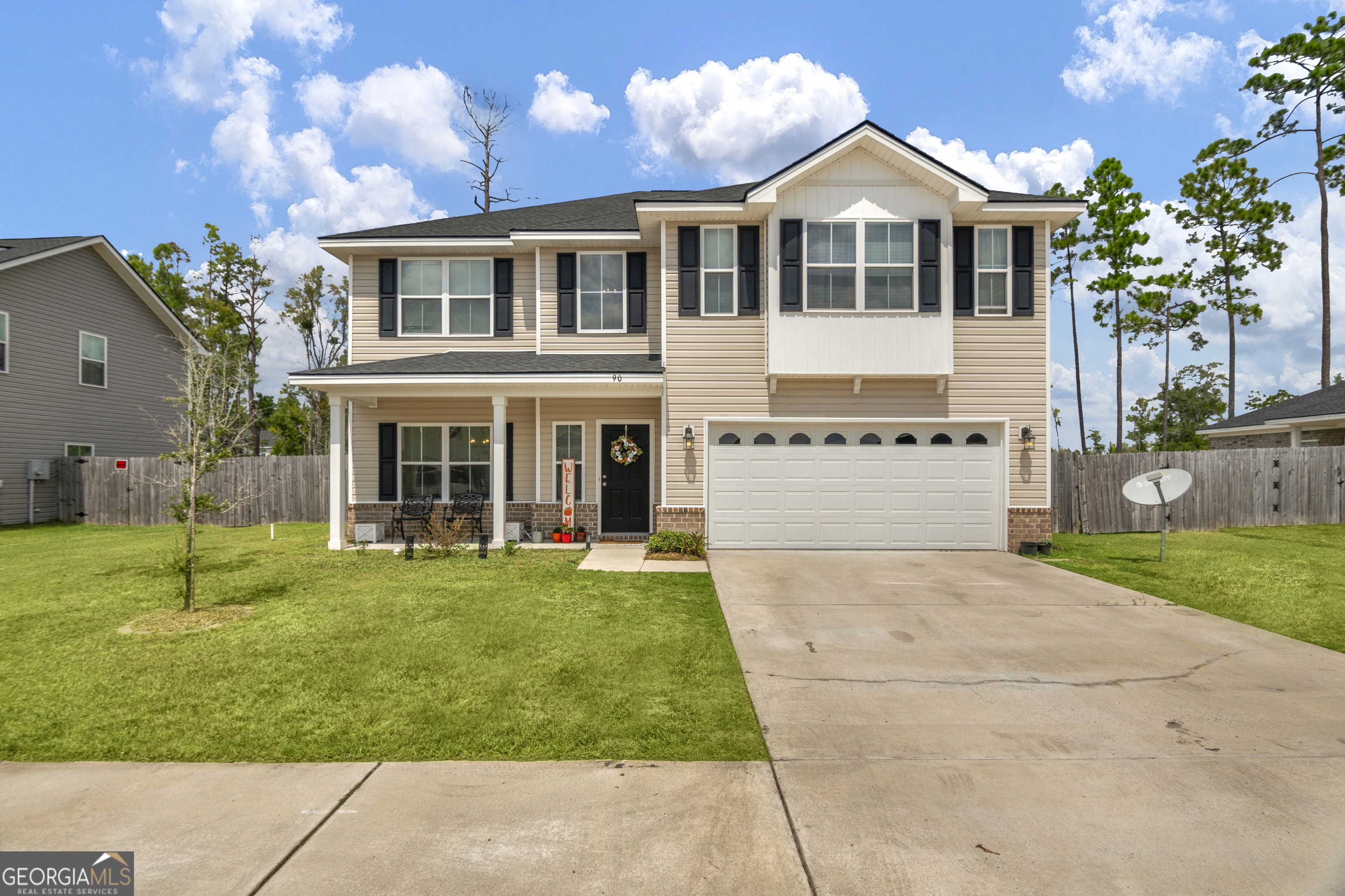 a front view of a house with a yard