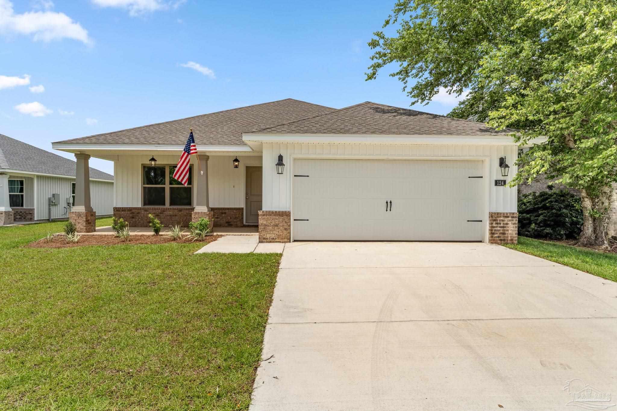 a front view of house with yard