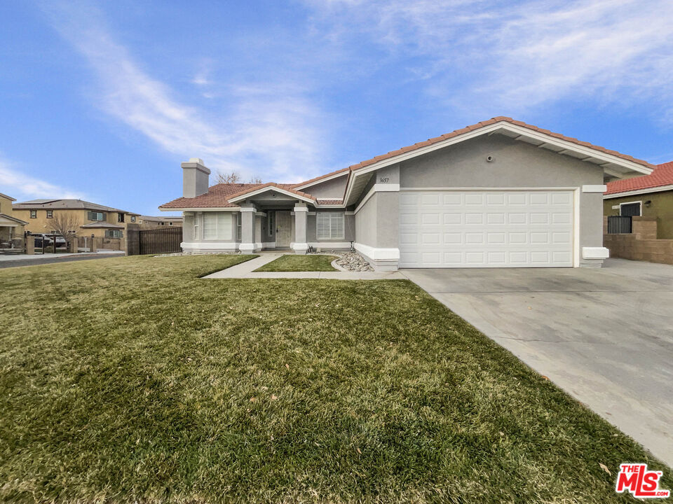 a front view of a house with yard