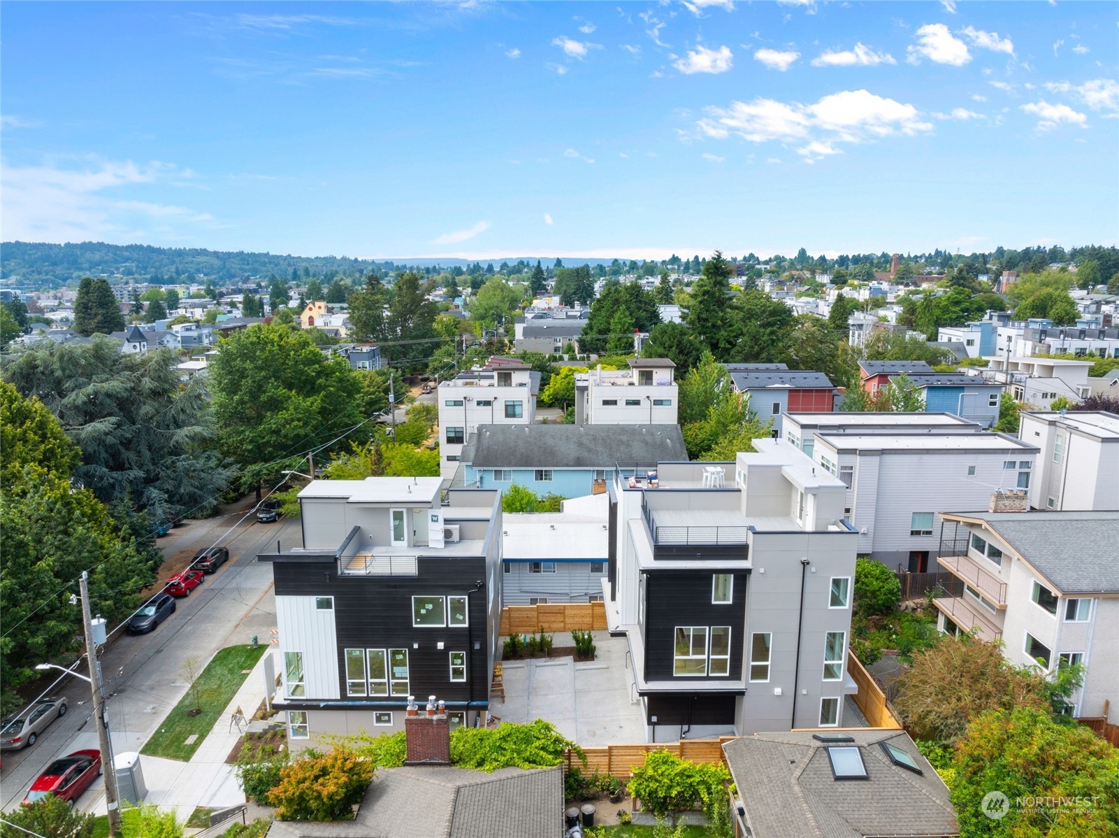 a view of multiple houses with yard