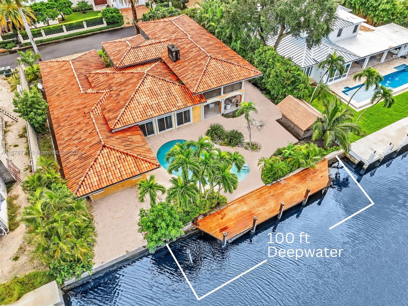 an aerial view of a house with a garden