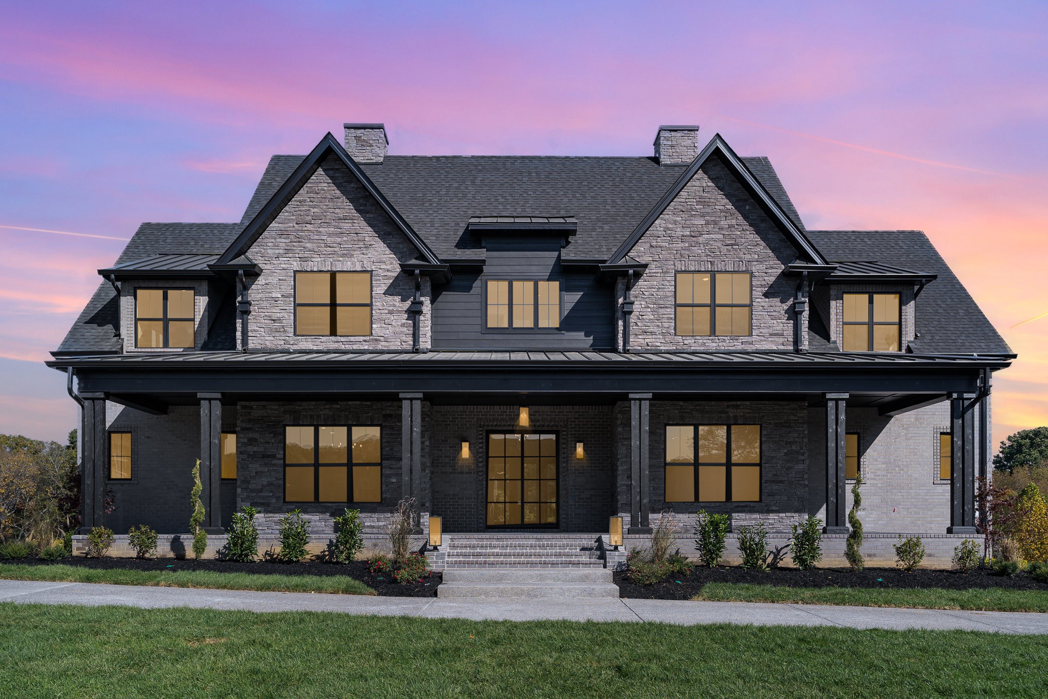 front view of a house with a yard