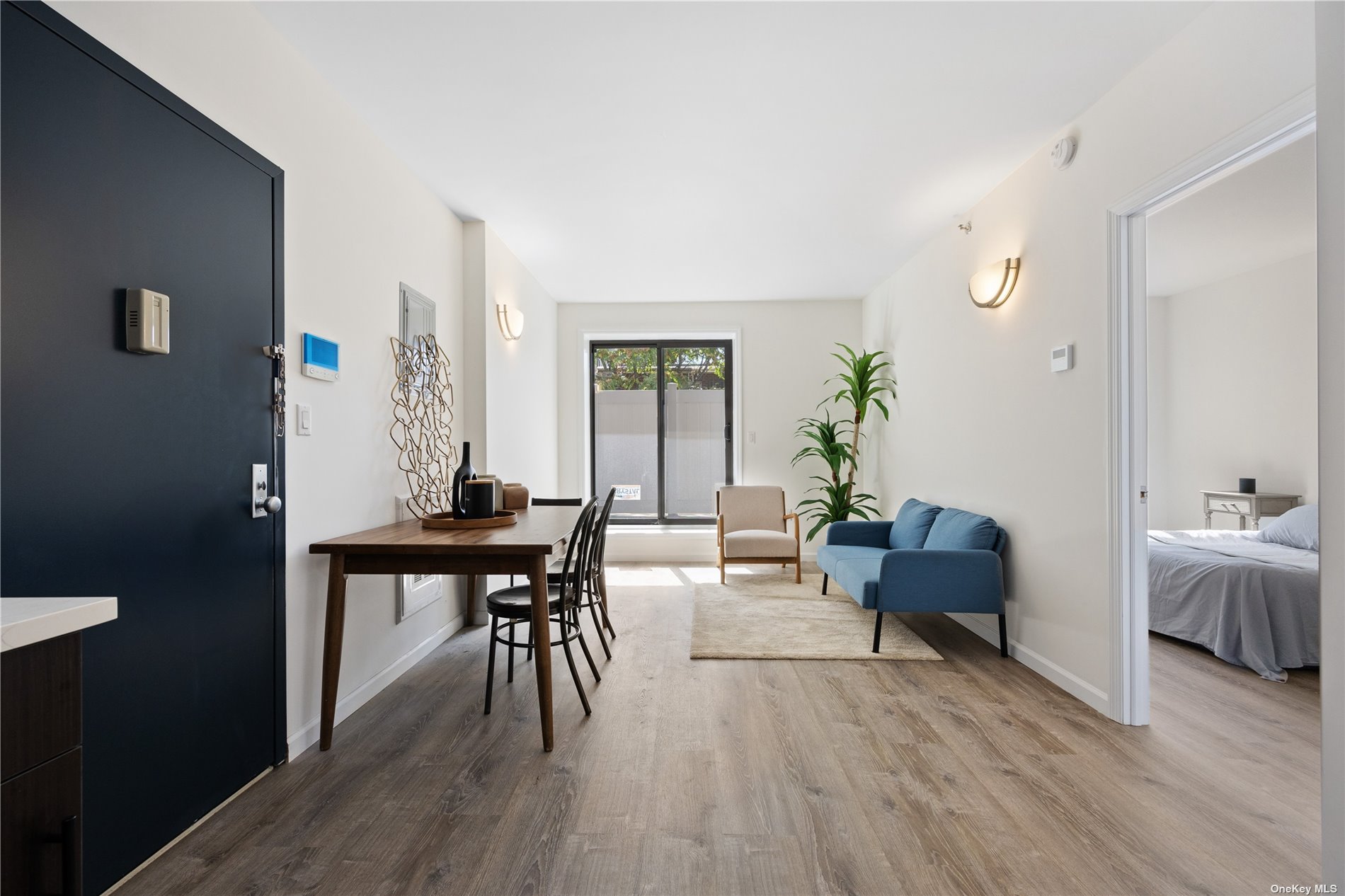 a view of a livingroom with furniture and wooden floor