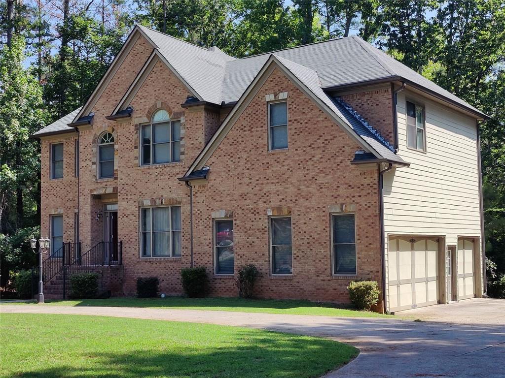 a front view of a house with a yard