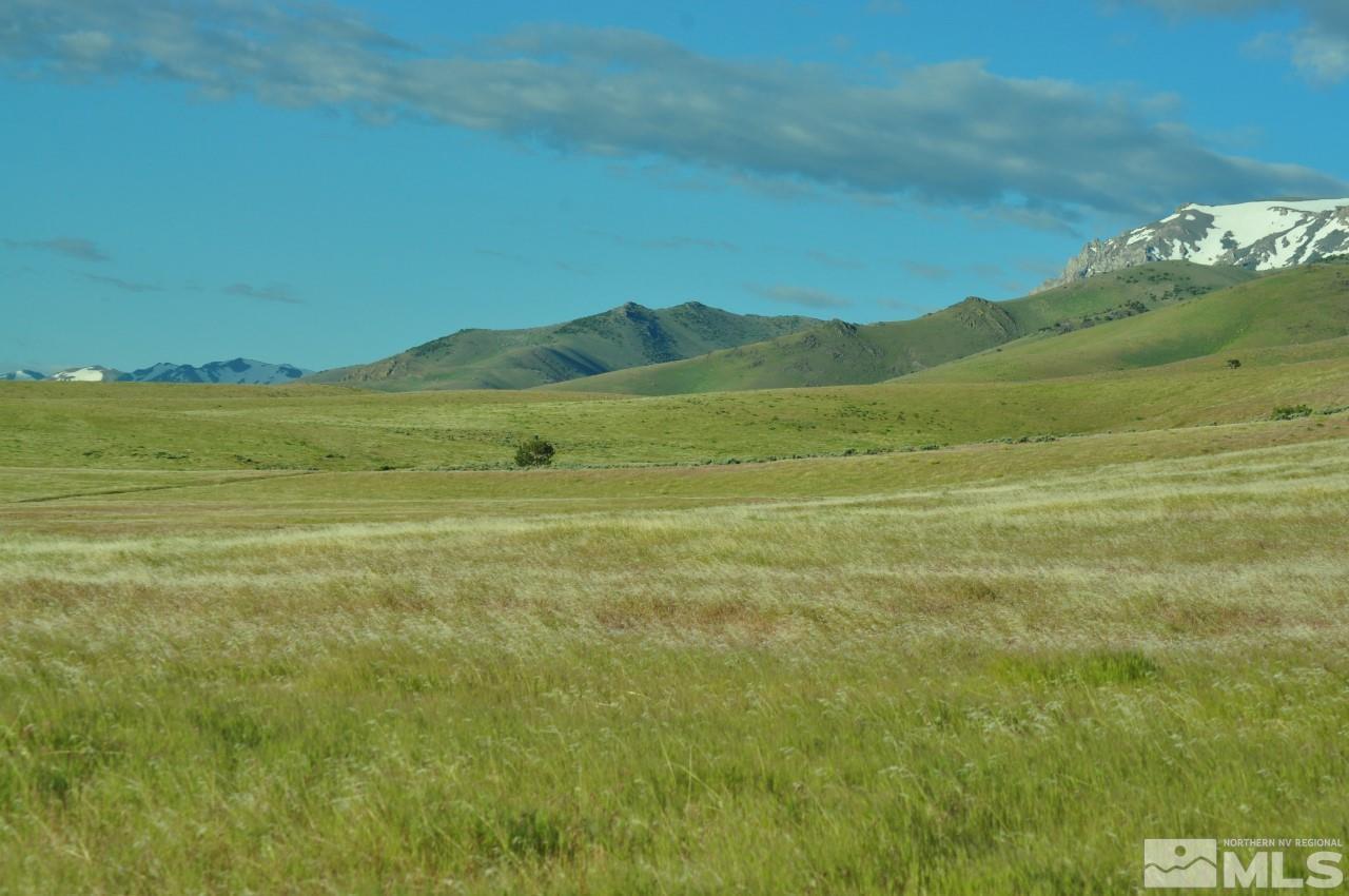 a view of an ocean and a mountain