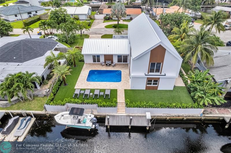 a aerial view of a house with patio