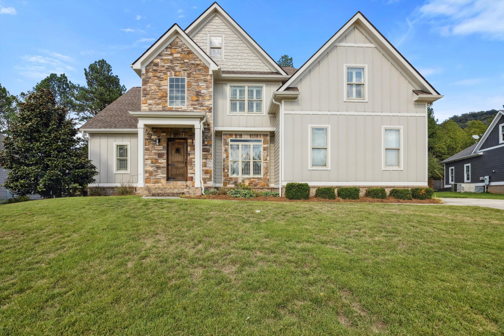 a front view of a house with a yard