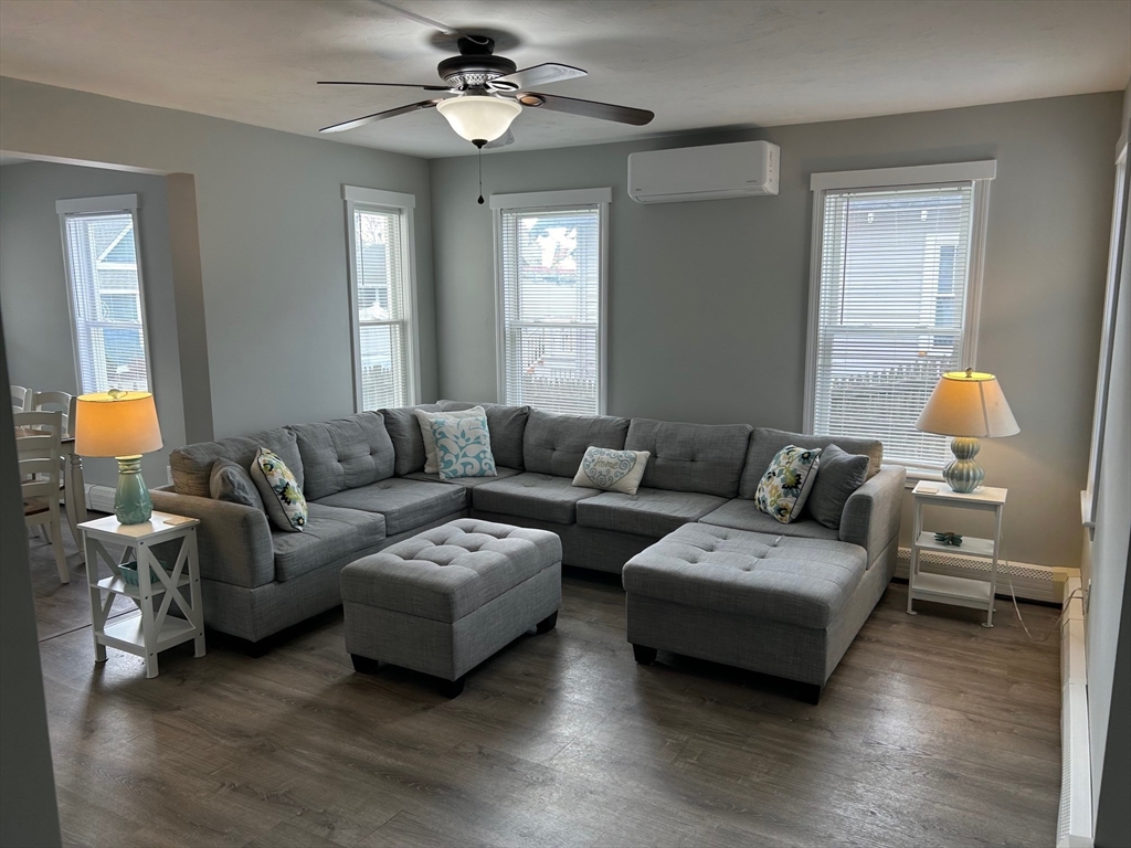 a living room with furniture and a window