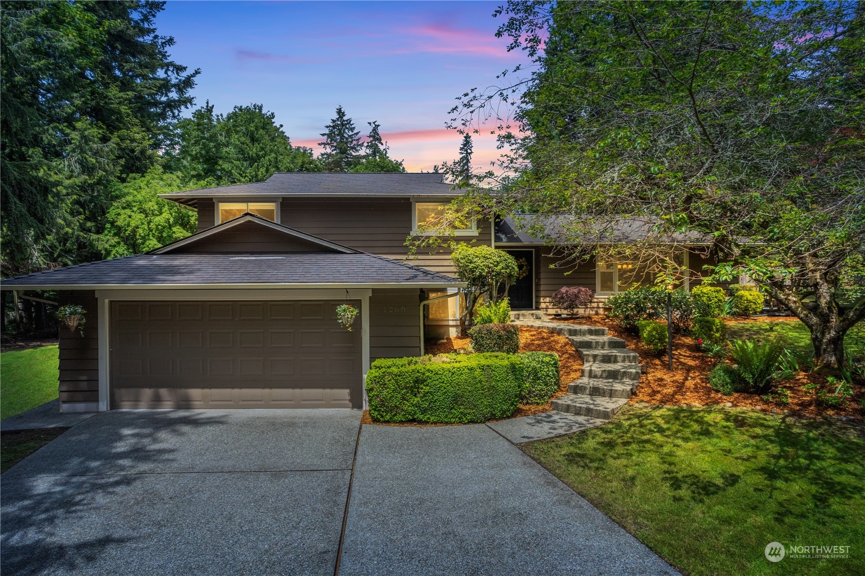 front view of a house with a yard