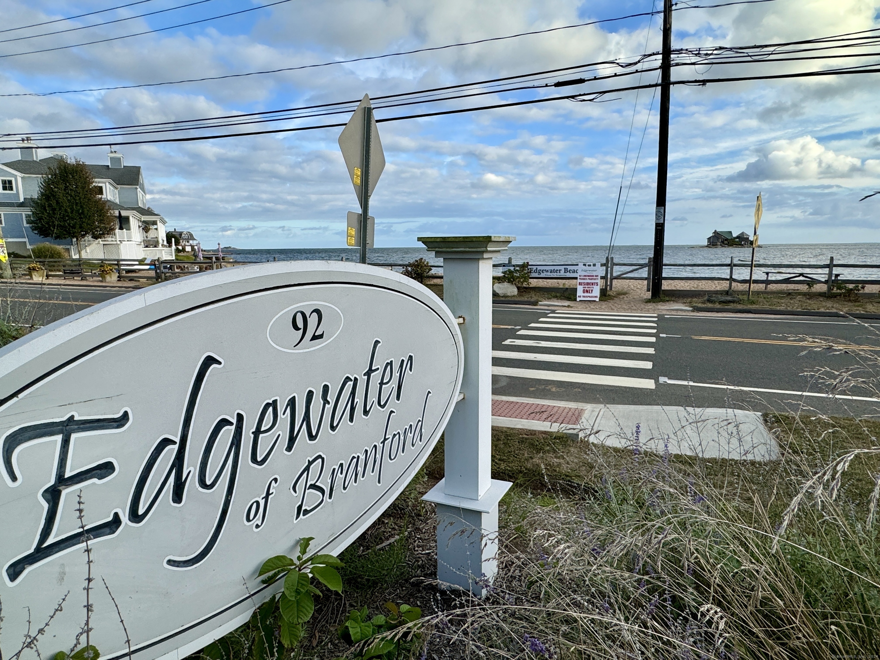 a view of a street with sign on the wall