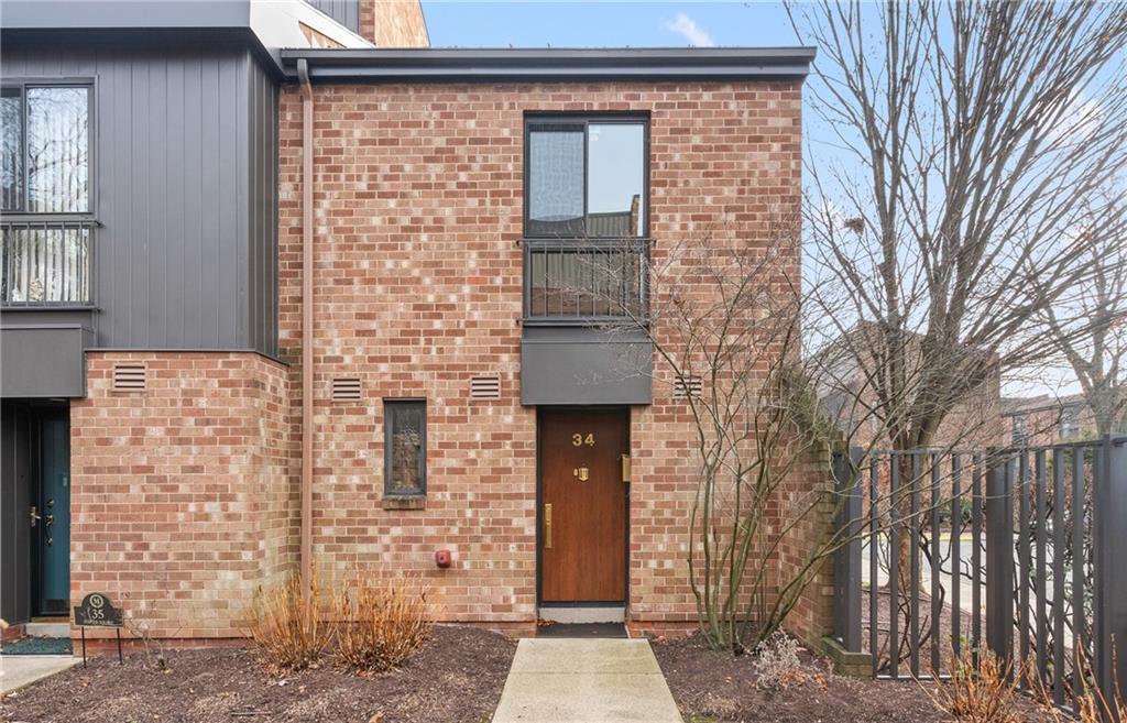 a brick house with a large windows