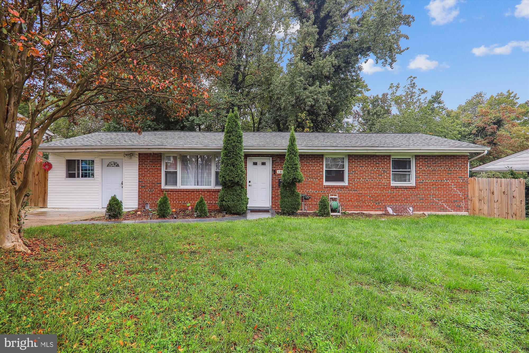 front view of a house with a yard