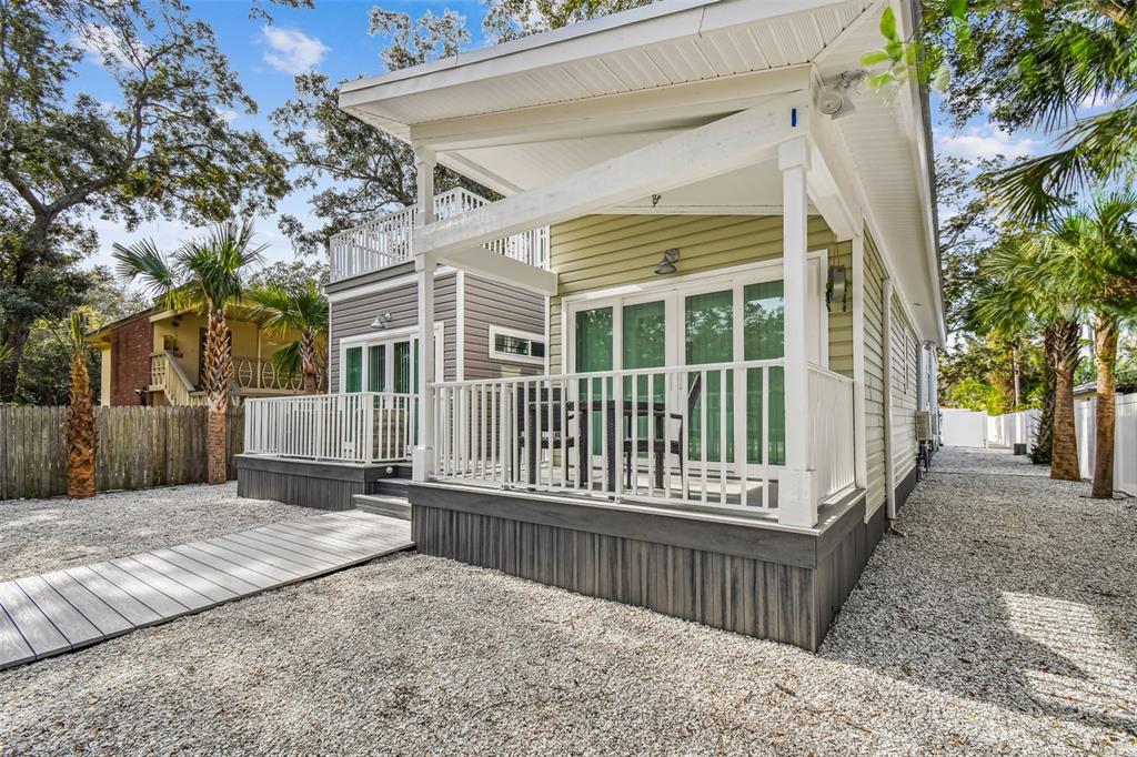 front view of a house with a wooden fence