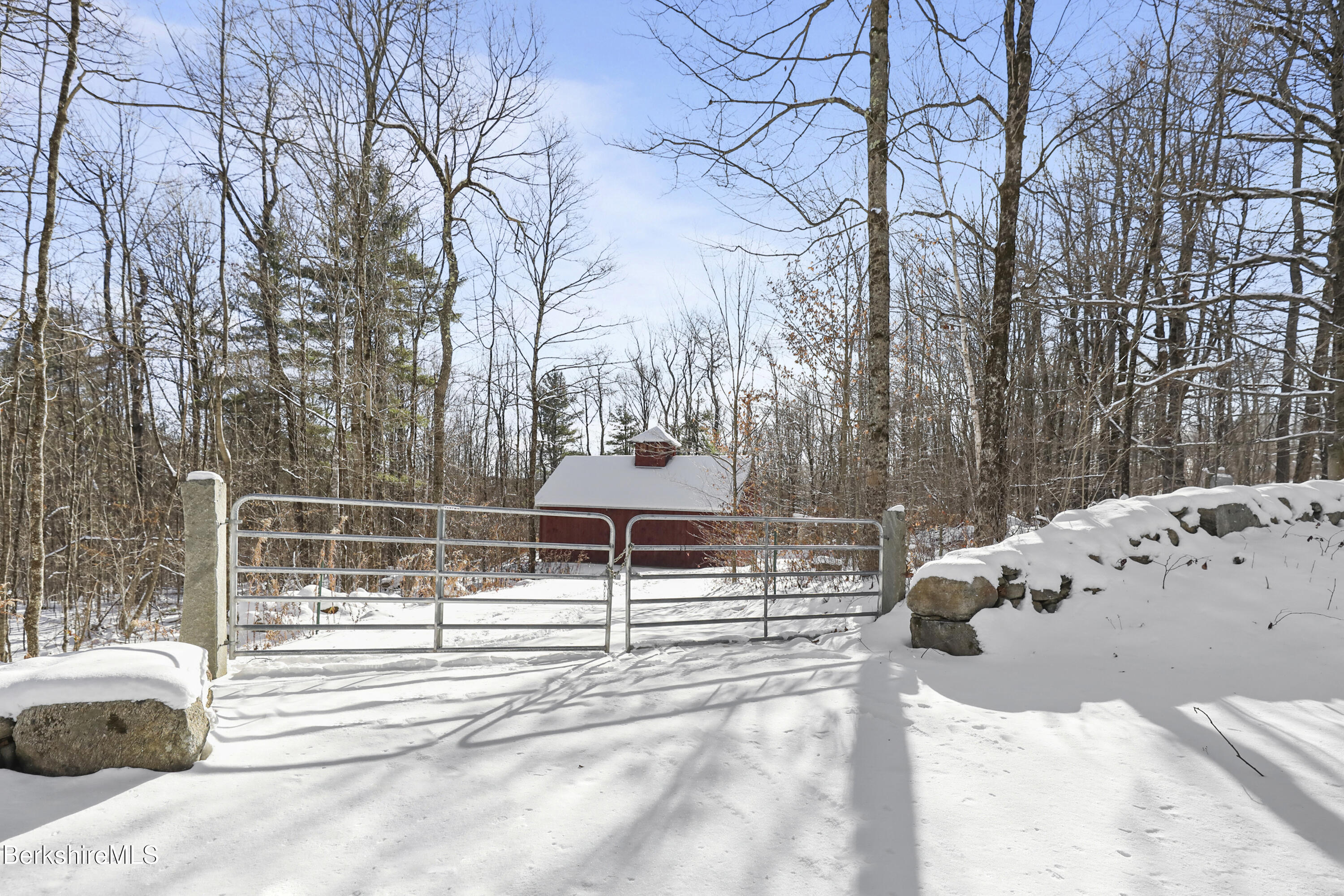 a view of a park with iron fence