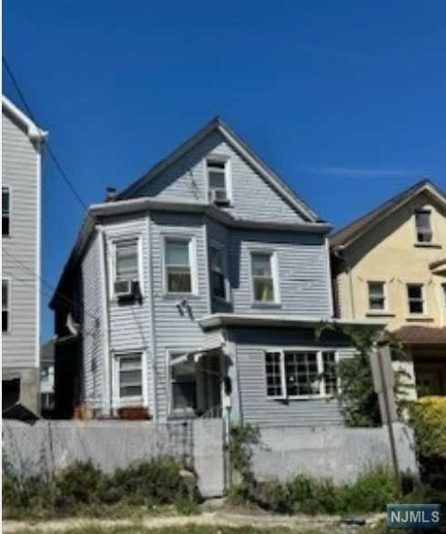 a front view of a house with yard