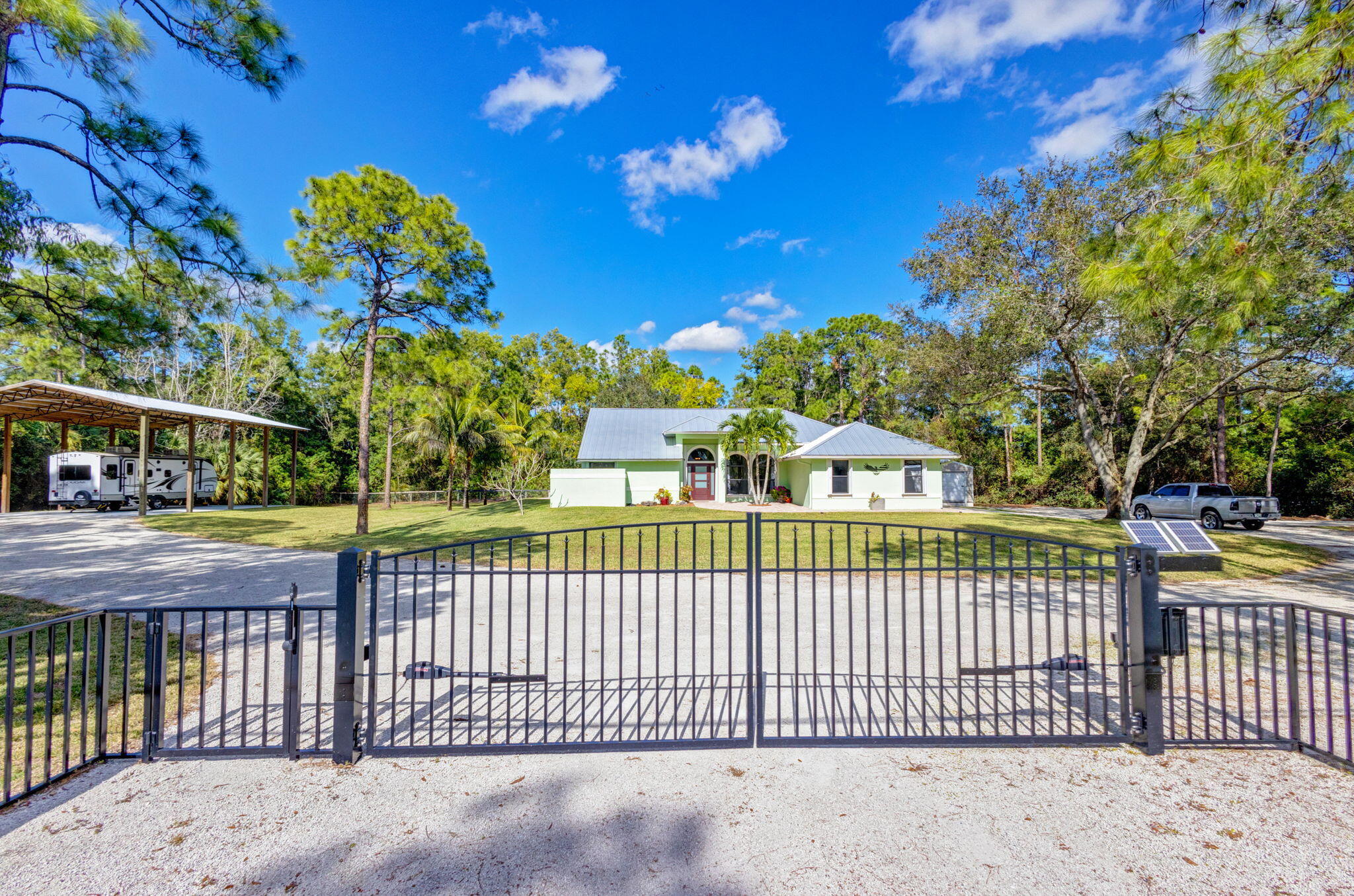 a view of a wrought iron fences in front of house